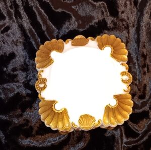 Milk glass trinket box with gold shell motif